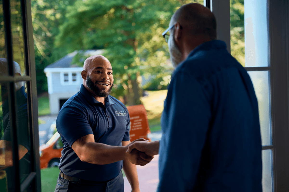 Technician shaking customers hand