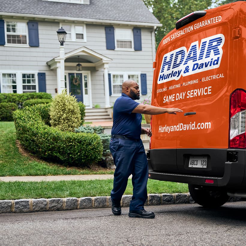 A Hurley and David technician arrives at a home ready to provide expert HVAC, plumbing, and electrical services.