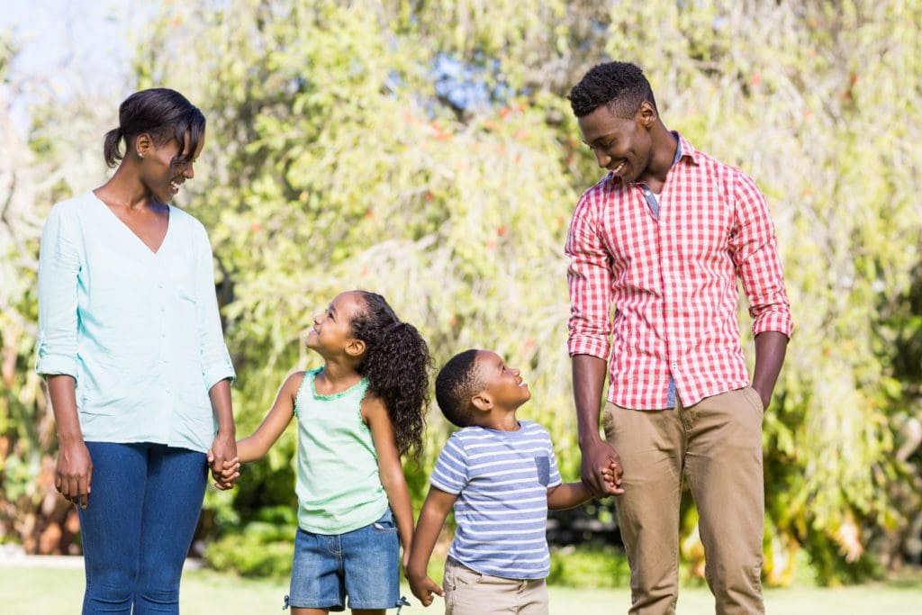 happy family posing together at the park