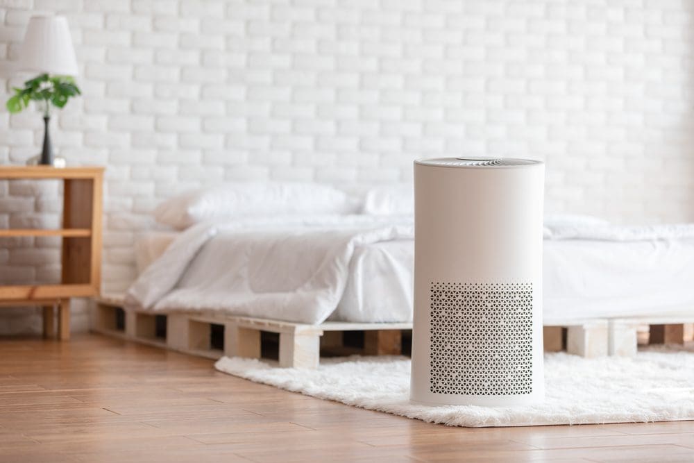 air purifier in cozy bedroom setting