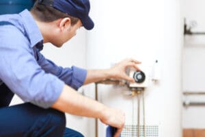 plumber fixing a hot water heater