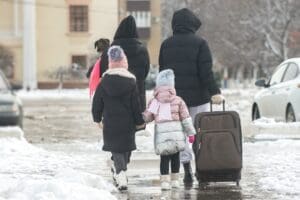 family leaving home on vacation during winter